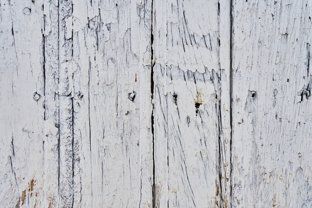 Old wooden texture of windows and doors weathered by time with cracks and rusty nails - Foto, immagini