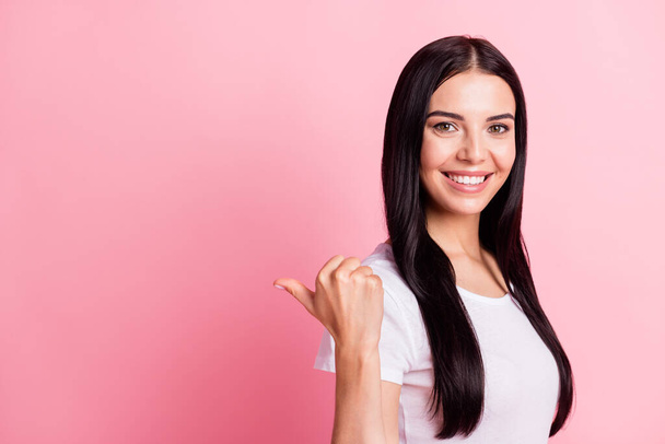 Profile photo of optimistic brunette lady point empty space wear white t-shirt isolated on pastel pink color background - Φωτογραφία, εικόνα