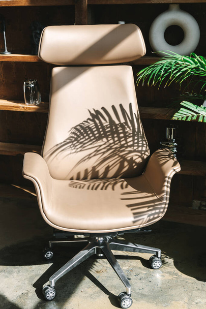 Modern interior with beige leather office chair - Foto, Imagen