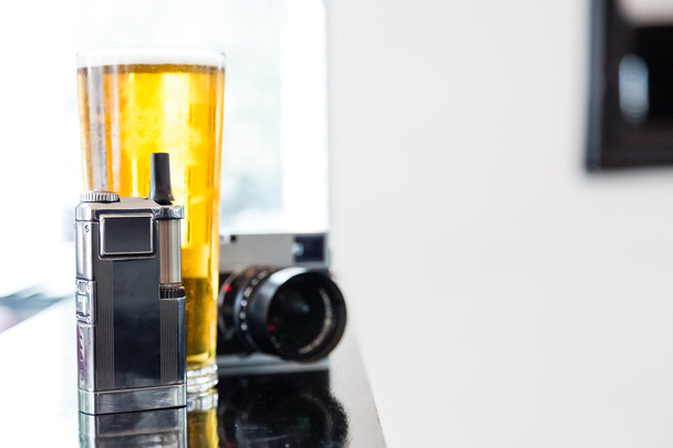 Portable vaporizer, digital camera and beer - Photo, Image