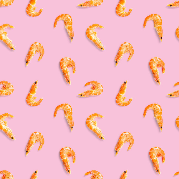 Tiger shrimp. Seamless pattern made from Prawn isolated on a pink background. Seafood seamless pattern with shrimps. seafood pattern - Photo, Image