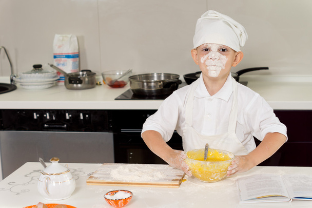 Young chef with flour on his face - 写真・画像