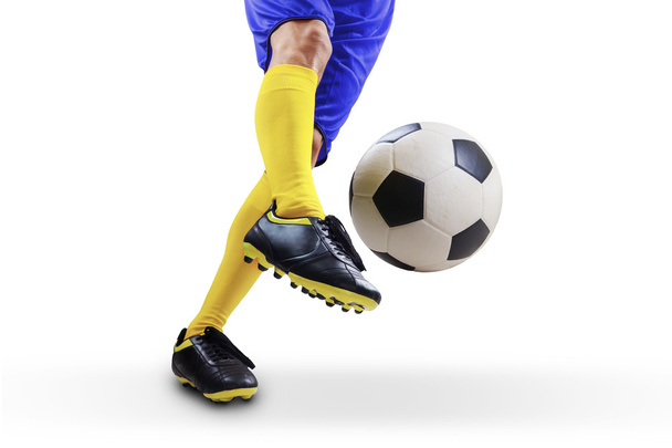 Football player kicking the ball - Foto, immagini