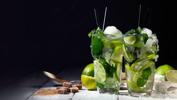 Fresh made Mojito cocktail on dark background. Summer drinks concept. Front view, Copy space, panorama - Zdjęcie, obraz