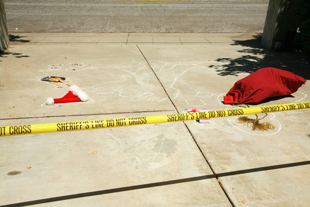 Santa Claus Drive By Shooting. Santa Claus shot dead in a drive by shooting. Real Sheriff crime scene. Santa Claus Dead in a driveway. Someone SHOT SANTA CLAUS in a Drive By Shooting! Santa Claus falls victim to violence and is killed.  - Photo, Image