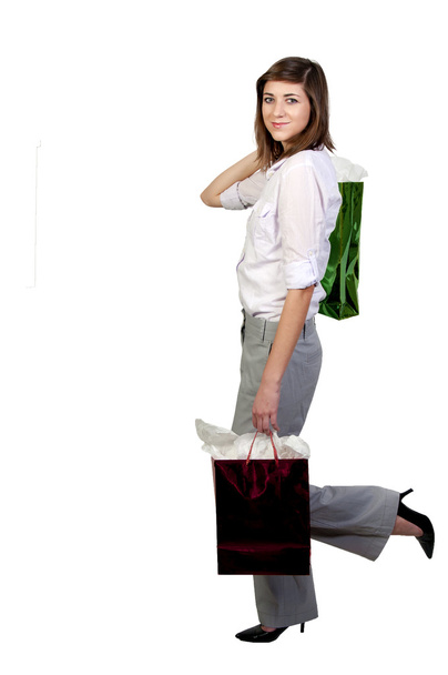 A beautiful young woman on a shopping spree - Foto, Bild