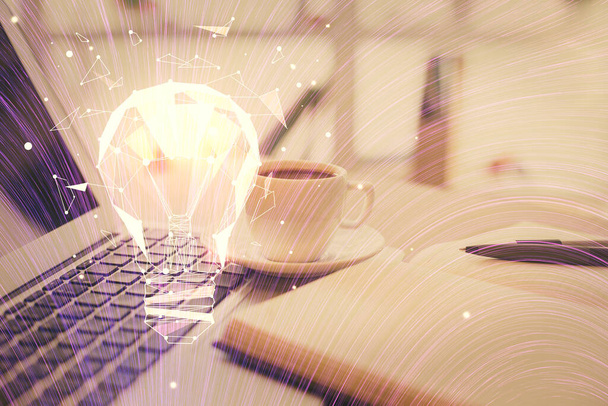 Double exposure of bulb drawing and desktop with coffee and items on table background. Concept of ideas. - Foto, imagen