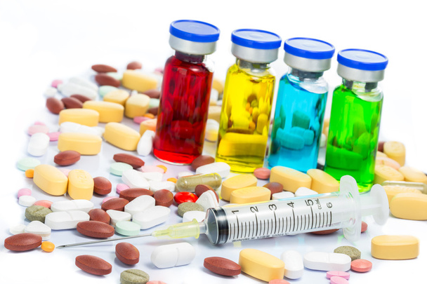 Colorido de ampollas médicas y jeringa
 - Foto, imagen