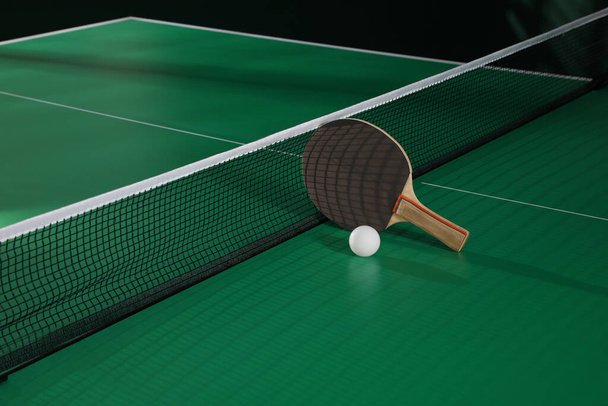 Black racket and ball on green ping pong table indoors - Foto, afbeelding