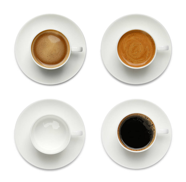 Set with cups of hot aromatic coffee on white background, top view  - 写真・画像