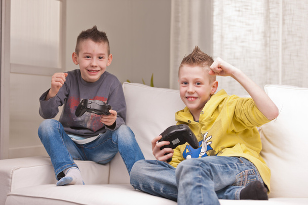 two kids playing video games - Photo, Image