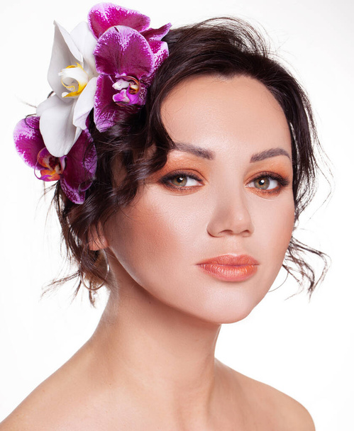 Beautiful portrait girl with flower orchid lips Fashion Beauty  - Valokuva, kuva