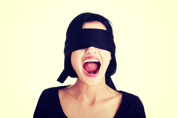 Blindfolded woman screaming - Foto, afbeelding