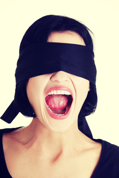 Blindfolded woman screaming - Фото, изображение