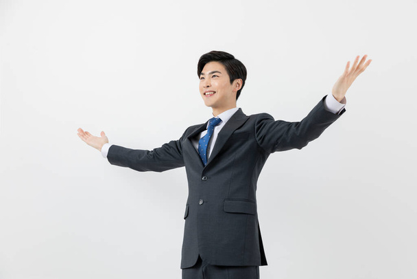 smiling young Asian handsome employee man, achieved, success concept - Фото, изображение