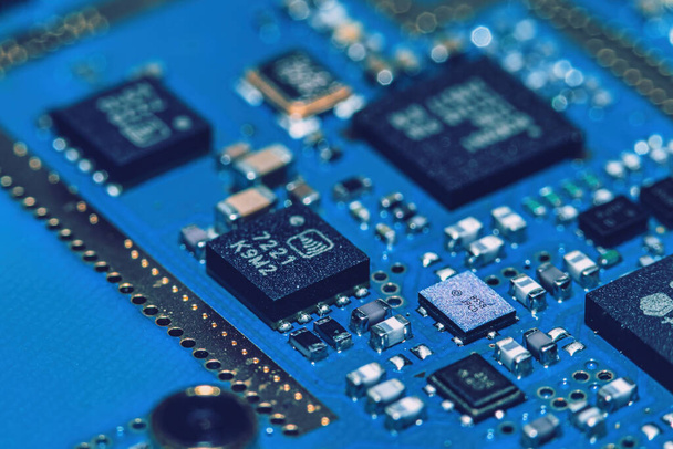 Microchips integrated on the board. The microcircuit photographed in close-up. - Photo, Image