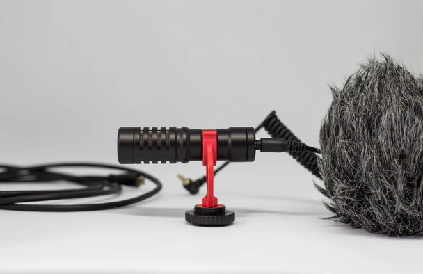 A closeup shot of a professional microphone on a white background - Zdjęcie, obraz