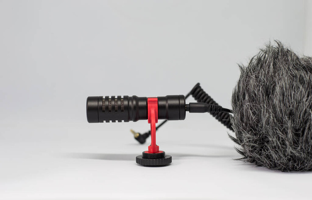 A closeup shot of a professional microphone on a white background - Φωτογραφία, εικόνα