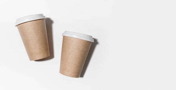 Disposable paper coffee cup isolated on white background. Mockup. Zero waste minimalistic concept. Copy space - Фото, зображення