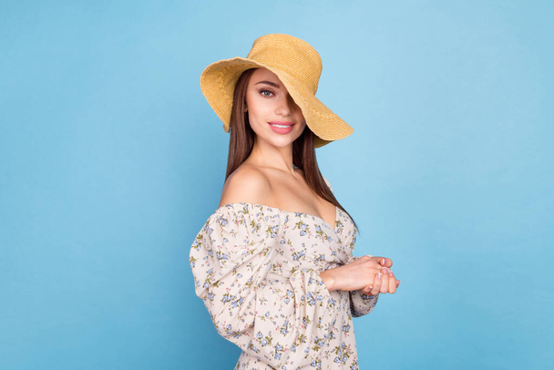 Profile photo of sweet brown hairdo millennial lady wear floral dress hat isolated on blue color background - Foto, Imagen