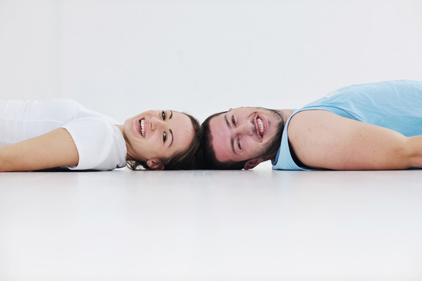 Happy young couple fitness workout and fun at sport gym club - Photo, Image