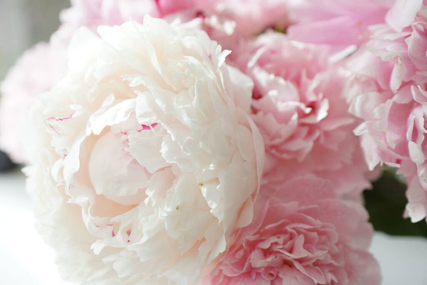 Bouquet of pink peonies on the dresser in the bedroom - Photo, Image