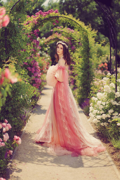 beautiful young princess in a magic rose garden  - Φωτογραφία, εικόνα