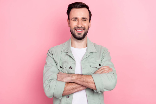Portrait of attractive cheerful content guy folded arms good mood isolated over pink pastel color background - Fotó, kép
