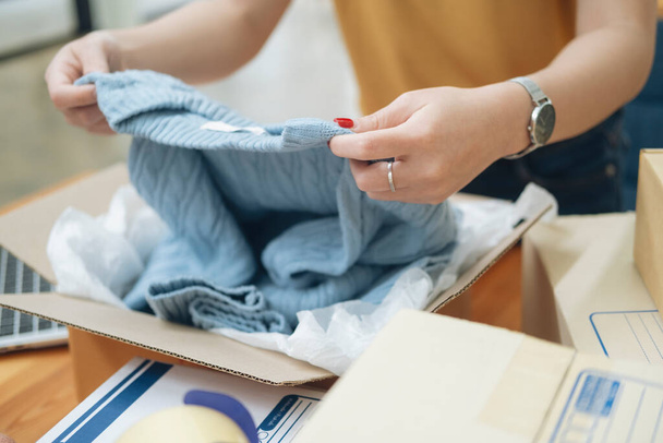 Online small business owner. Young startup entrepreneur online small business owner working at home, packaging and delivery situation.  - 写真・画像