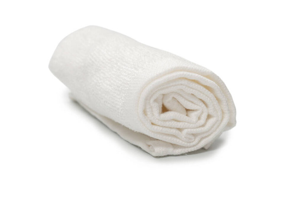 White fluffy cotton towel isolated on a white background. Spa and resort.  - Photo, Image
