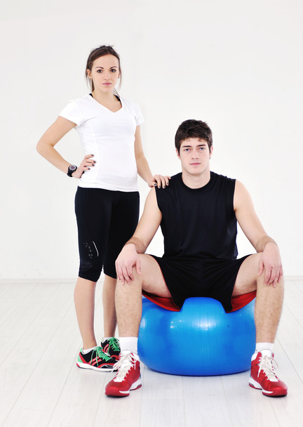 Happy young couple fitness workout and fun at sport gym club - Фото, зображення