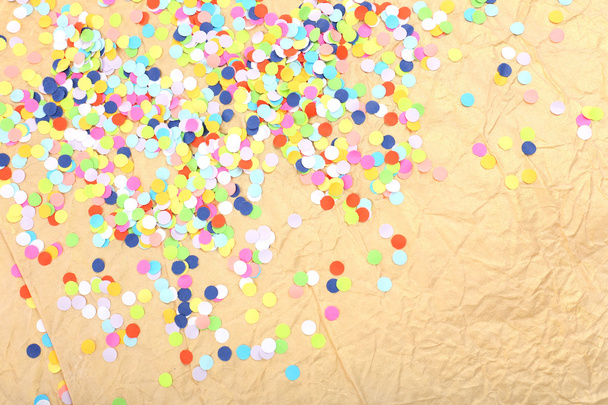 Confetti on wrinkled paper background - Foto, imagen