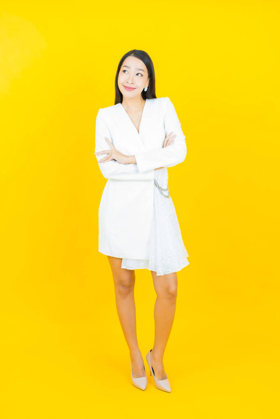 Portrait beautiful young asian woman smile with action on color background - Photo, image