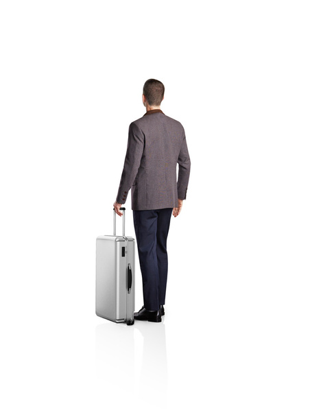 Businessman with a luggage - Фото, изображение