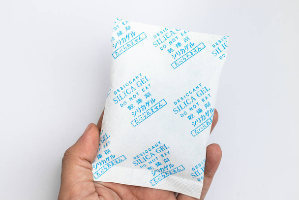 Desiccant silica on the pack. Closeup view. packet of silica gel buried in silica crystals - Zdjęcie, obraz