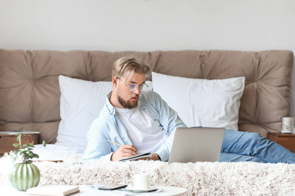 Young man studying online at home - Photo, image