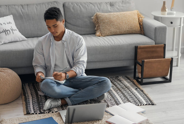 Young African-American guy studying online at home - Photo, Image