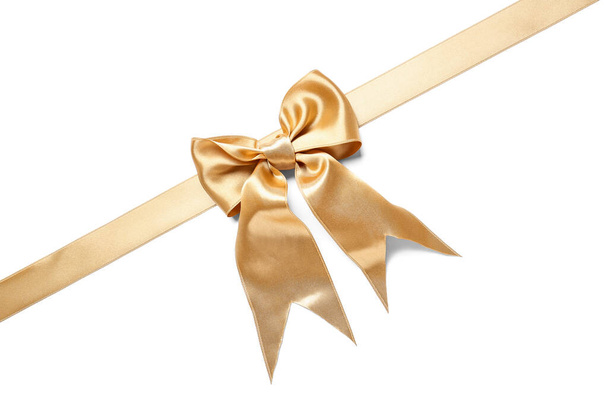 Beau ruban doré avec noeud sur fond blanc - Photo, image