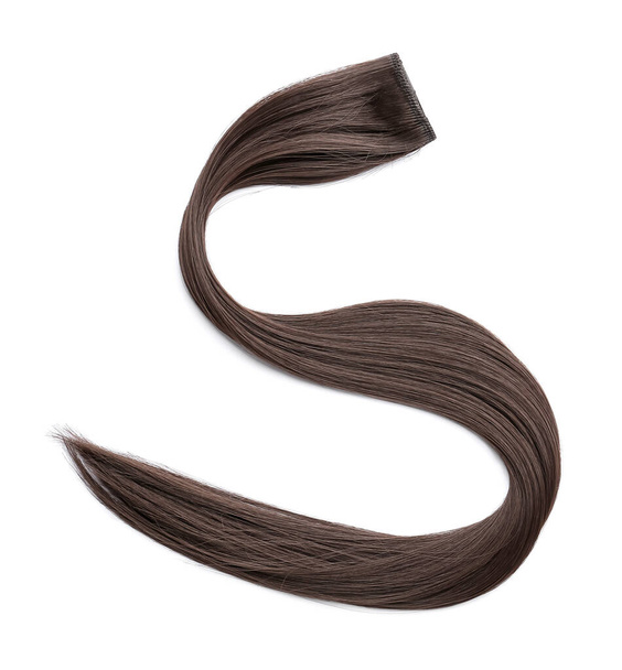 Strand of brown hair on white background - Φωτογραφία, εικόνα