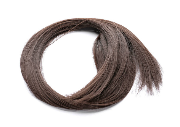 Strand of brown hair on white background - Fotó, kép
