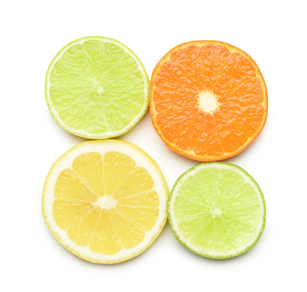 Healthy citrus fruit slices on white background - Fotó, kép