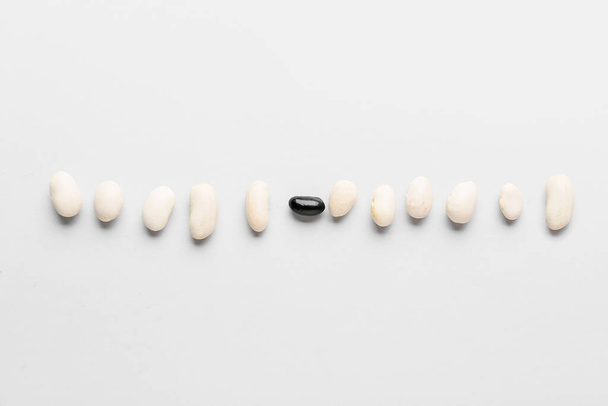 Beans on white background. Concept of racism - Photo, Image