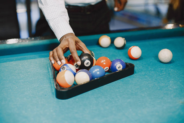 Man playing billiards in a club - Foto, immagini