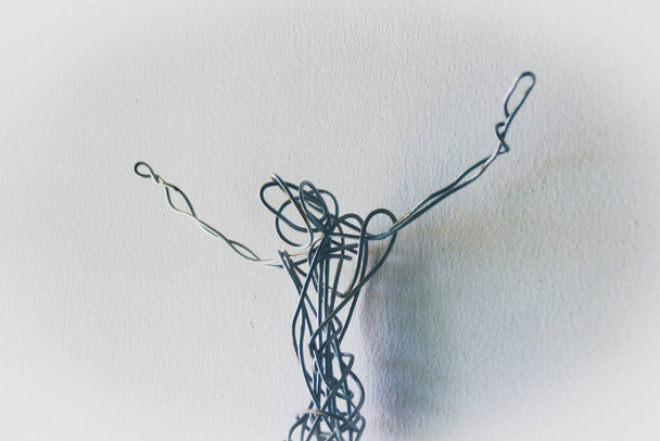 Photograph of a metal wire figure of Jesus Christ - Фото, изображение