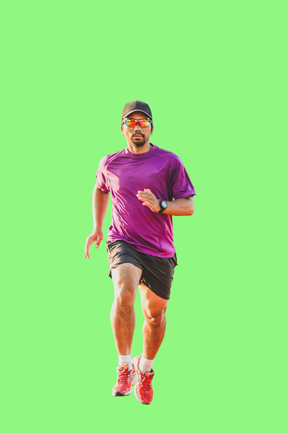 A runner, a middle-aged Asian man wearing glasses. wearing a hat on a colored background with clipping path - Foto, immagini