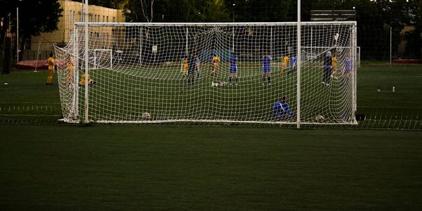 team playing football . Mesh for football goal background, sport texture, women football background. - Valokuva, kuva
