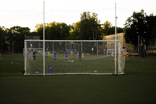 team playing football . Mesh for football goal background, sport texture, women football background. - Fotó, kép