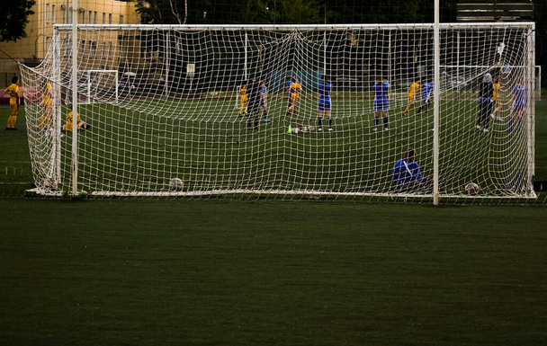 team playing football . Mesh for football goal background, sport texture, women football background. - Foto, Imagen