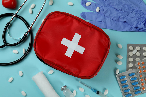 First aid medical kit on blue background - Fotoğraf, Görsel
