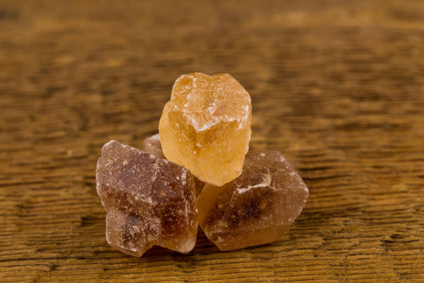 caramelized candy sweet brown sugar on a wood - Photo, image